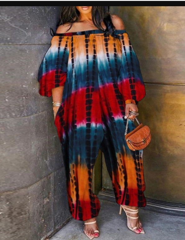 Macacão feminino plus size com estampa tie dye manga comprida